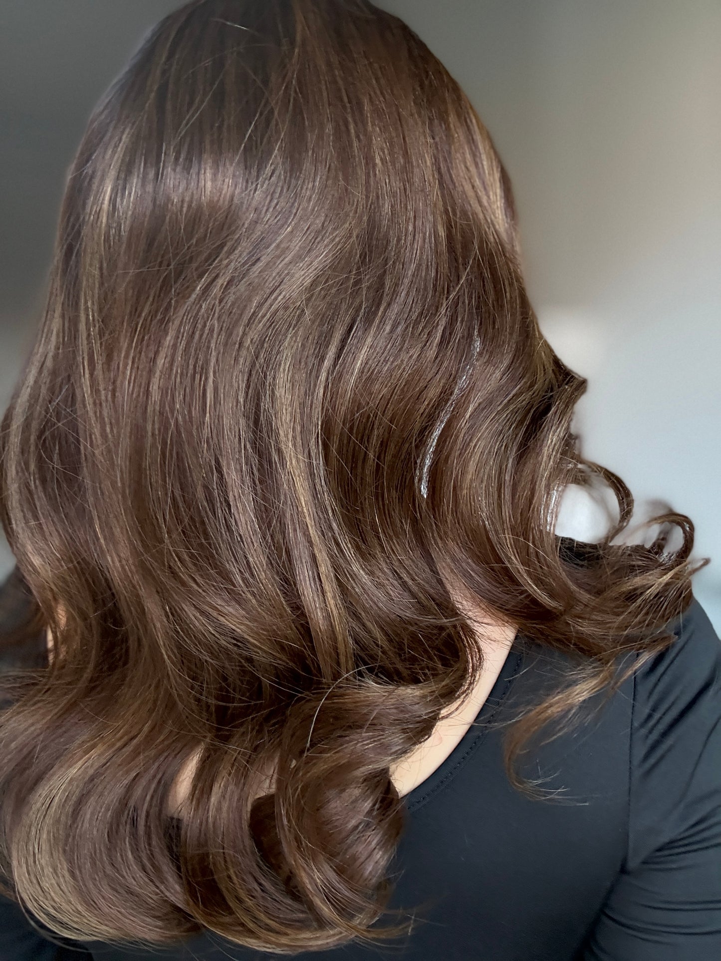 Brown wig with warm highlights and dark roots
