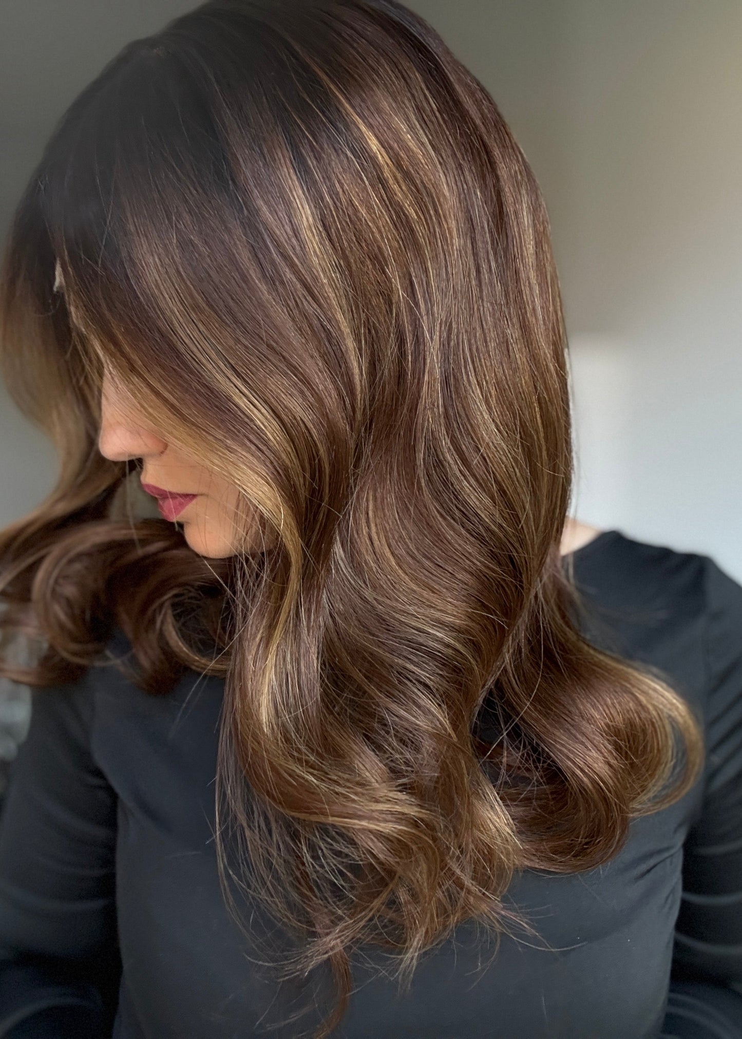 Brown wig with warm highlights and dark roots